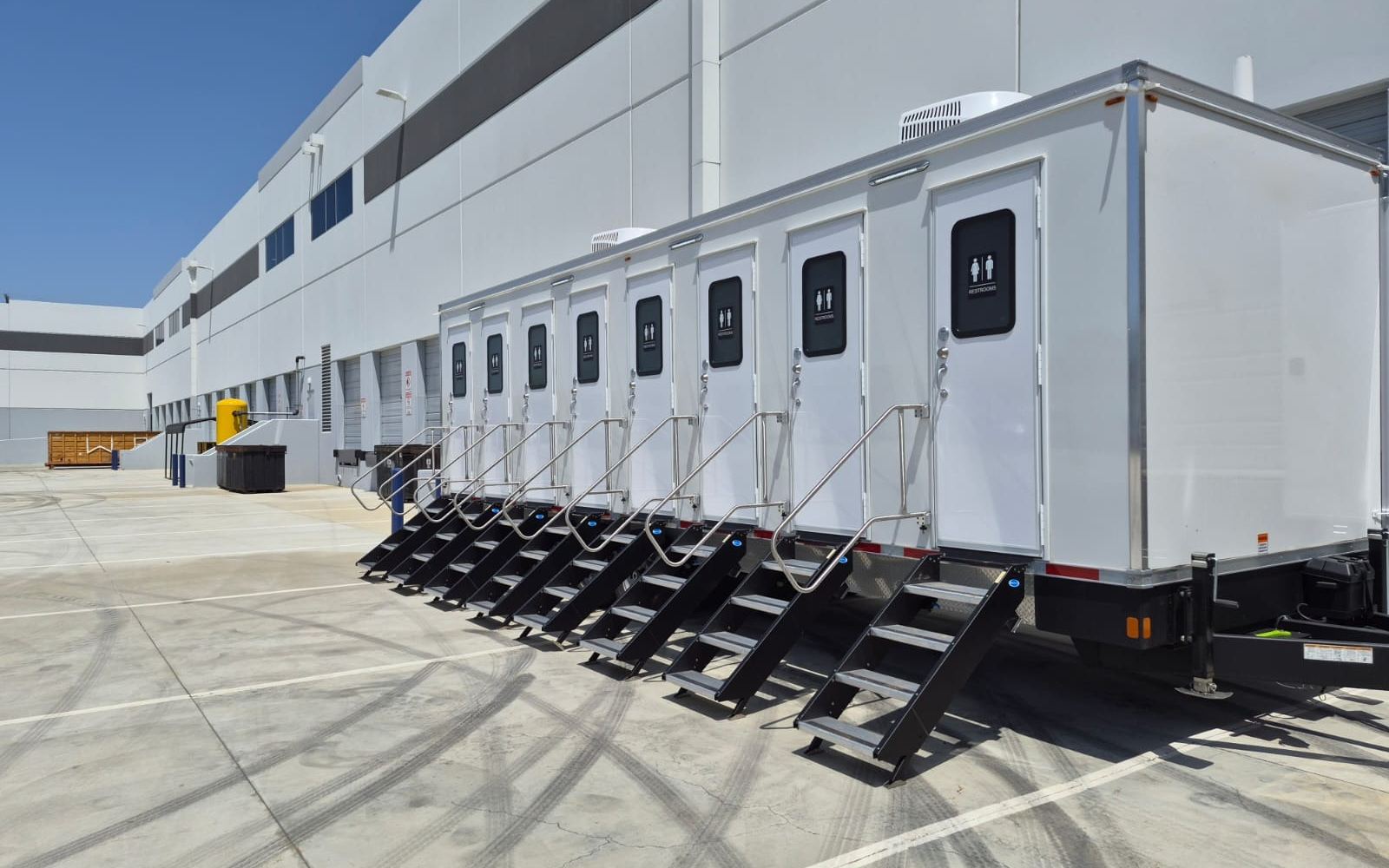 8-stall private bathroom trailer with eight unisex doors, each with its own stairs, The Lavatory NorCal