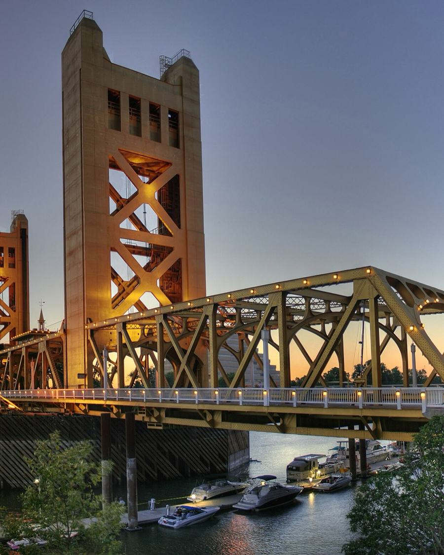 Gold Tower Bridge over the Sacramento River at dusk, in the Sacramento area served by The Lavatory NorCal