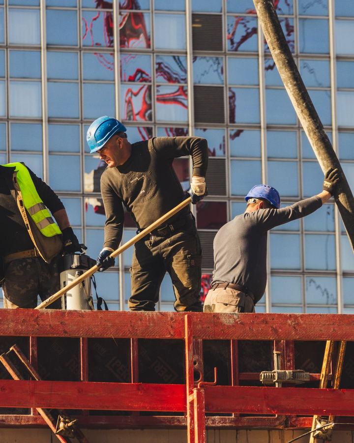 Construction crew in hard hats working on a building project, a use case for The Lavatory NorCal restroom trailers