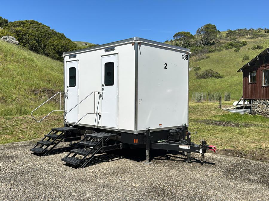 2-stall restroom trailer at a hillside ranch for a wedding in Marshall, The Lavatory NorCal