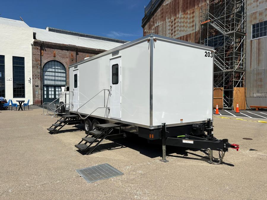 9-stall luxury restroom trailer outside historic brick event halls for a Y Combinator event, The Lavatory NorCal