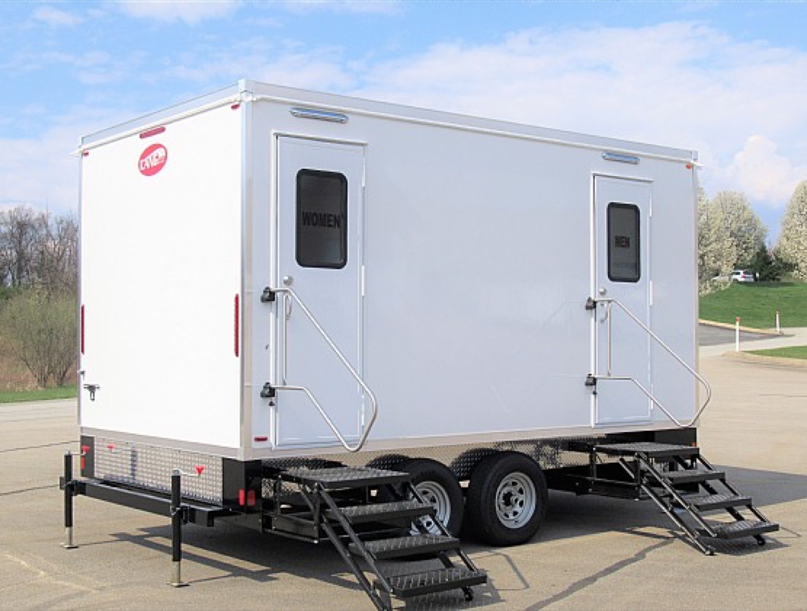 Multi-stall restroom trailer with separate men's and women's entries in a parking lot, The Lavatory NorCal
