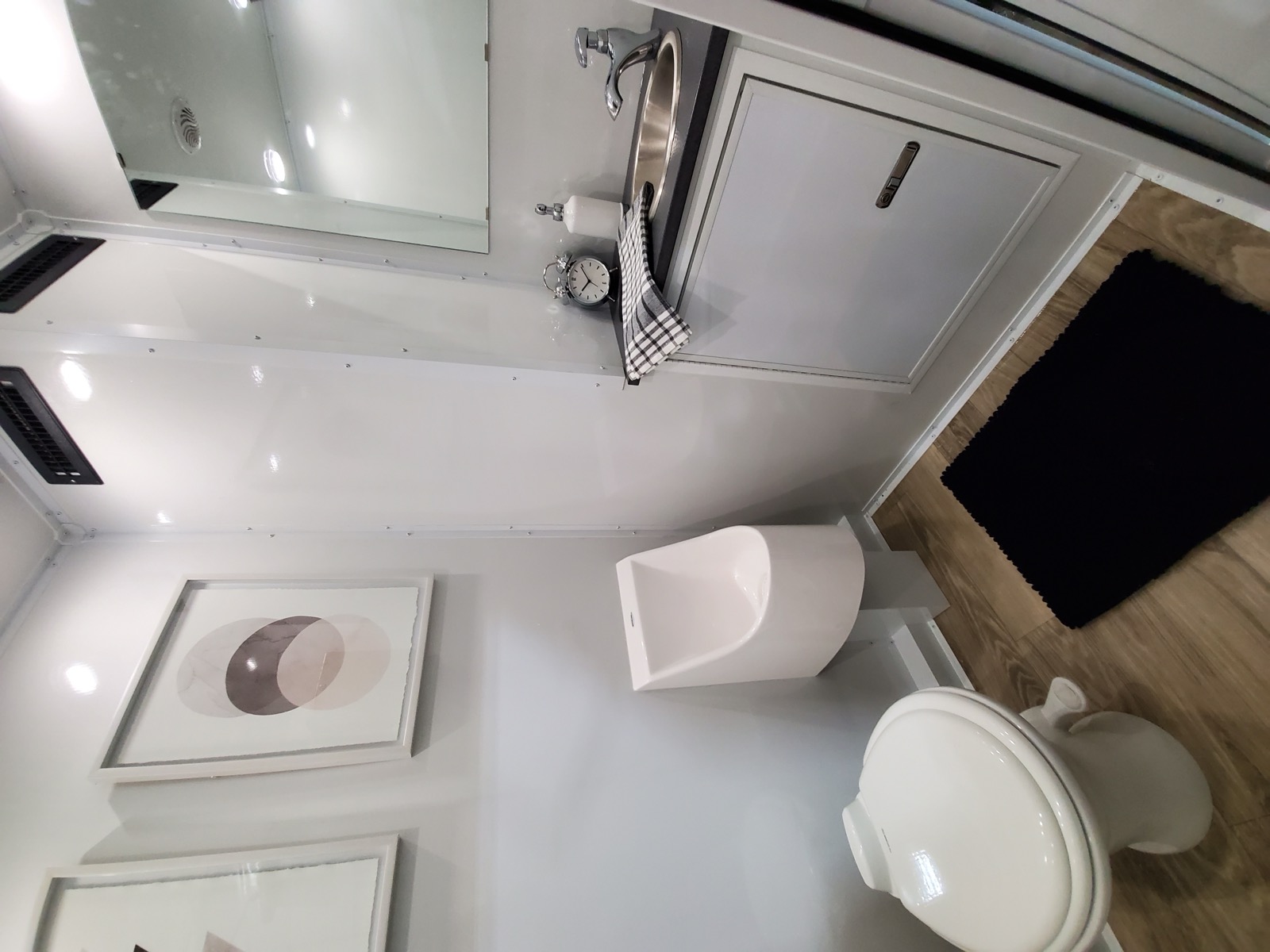 Men's stall in an ADA plus 2 portable bathroom trailer with a urinal and a compact sink, The Lavatory NorCal