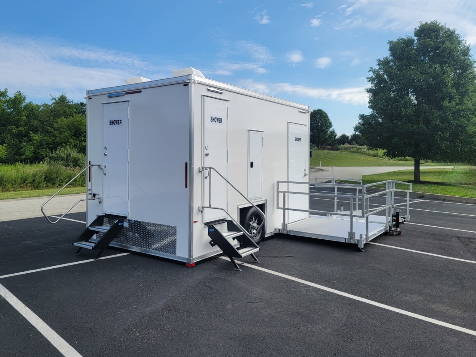 ADA plus 2 shower trailer with stairs to two shower rooms and a ramp platform, The Lavatory NorCal