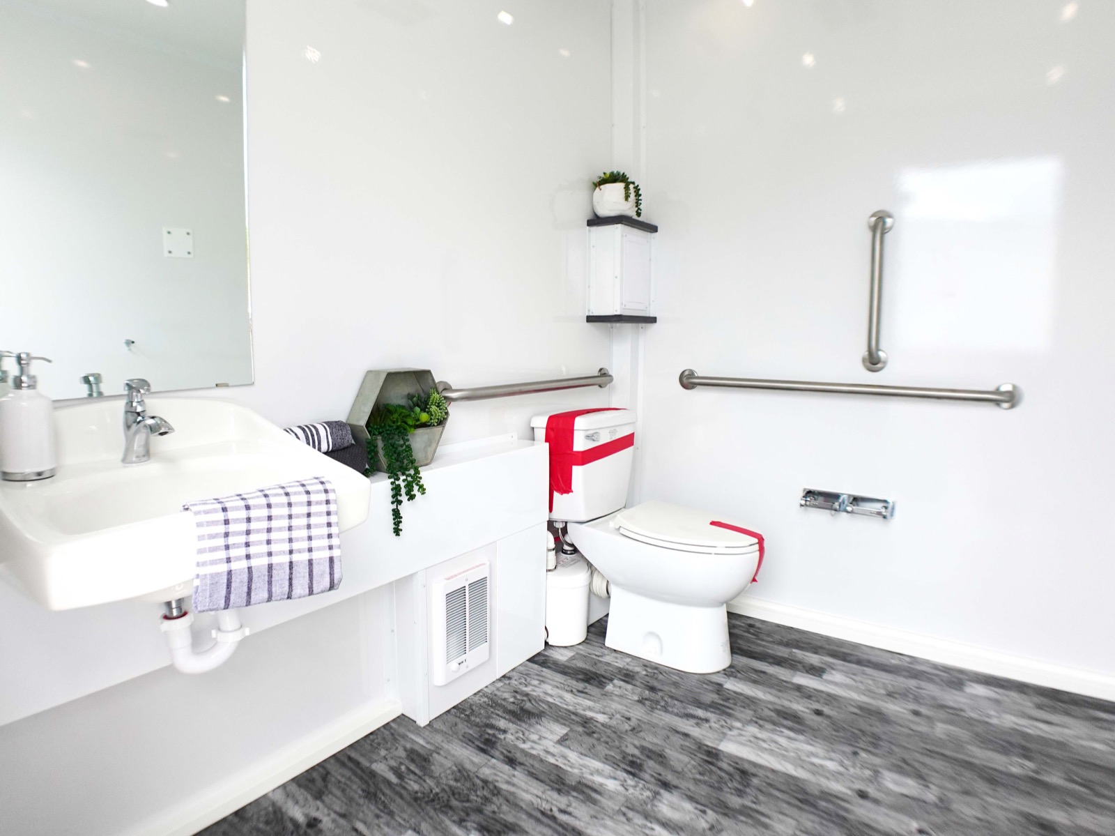 Accessible room with grab bars inside an ADA plus 6 restroom trailer, The Lavatory NorCal