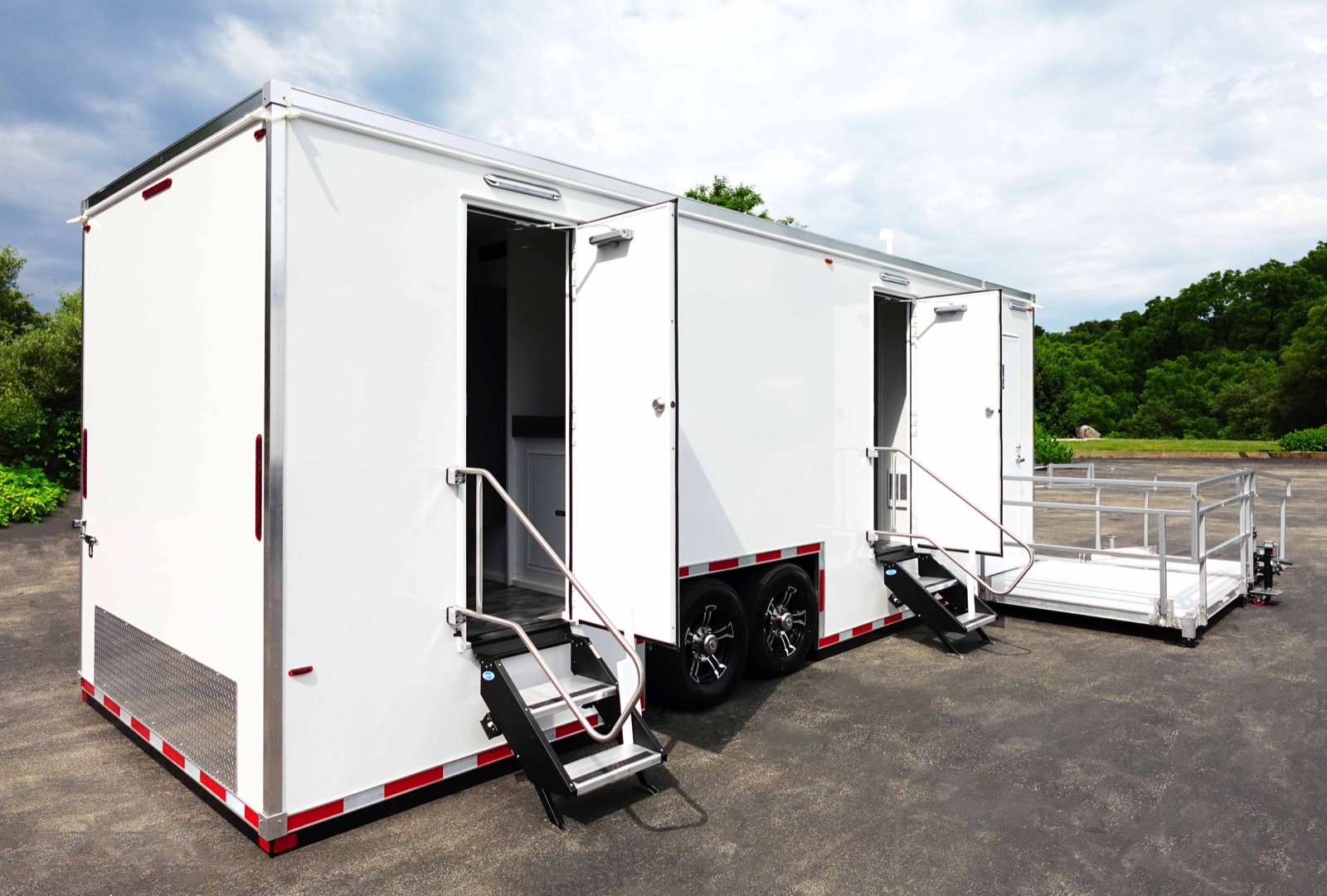 ADA plus 6 bathroom trailer with its doors open and a railed ramp platform, The Lavatory NorCal