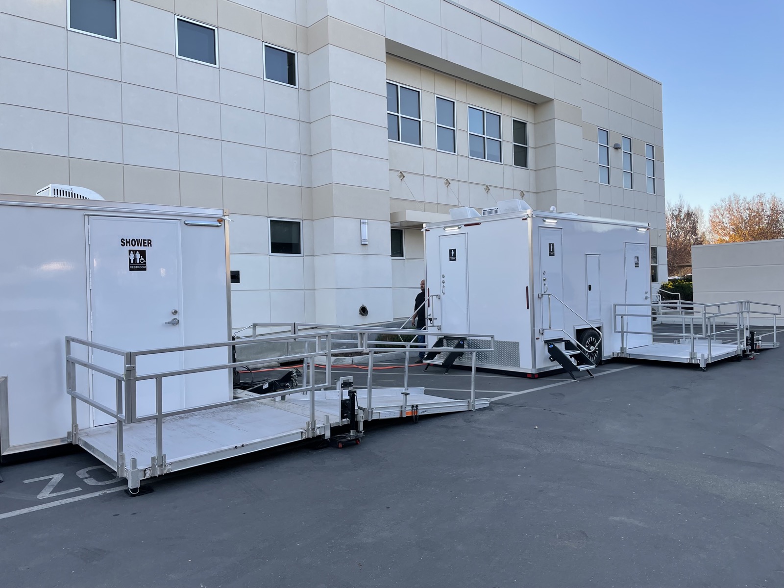 Accessible shower trailer and ADA plus 2 bathroom trailer with ramps set up for staff at a corporate campus, The Lavatory NorCal