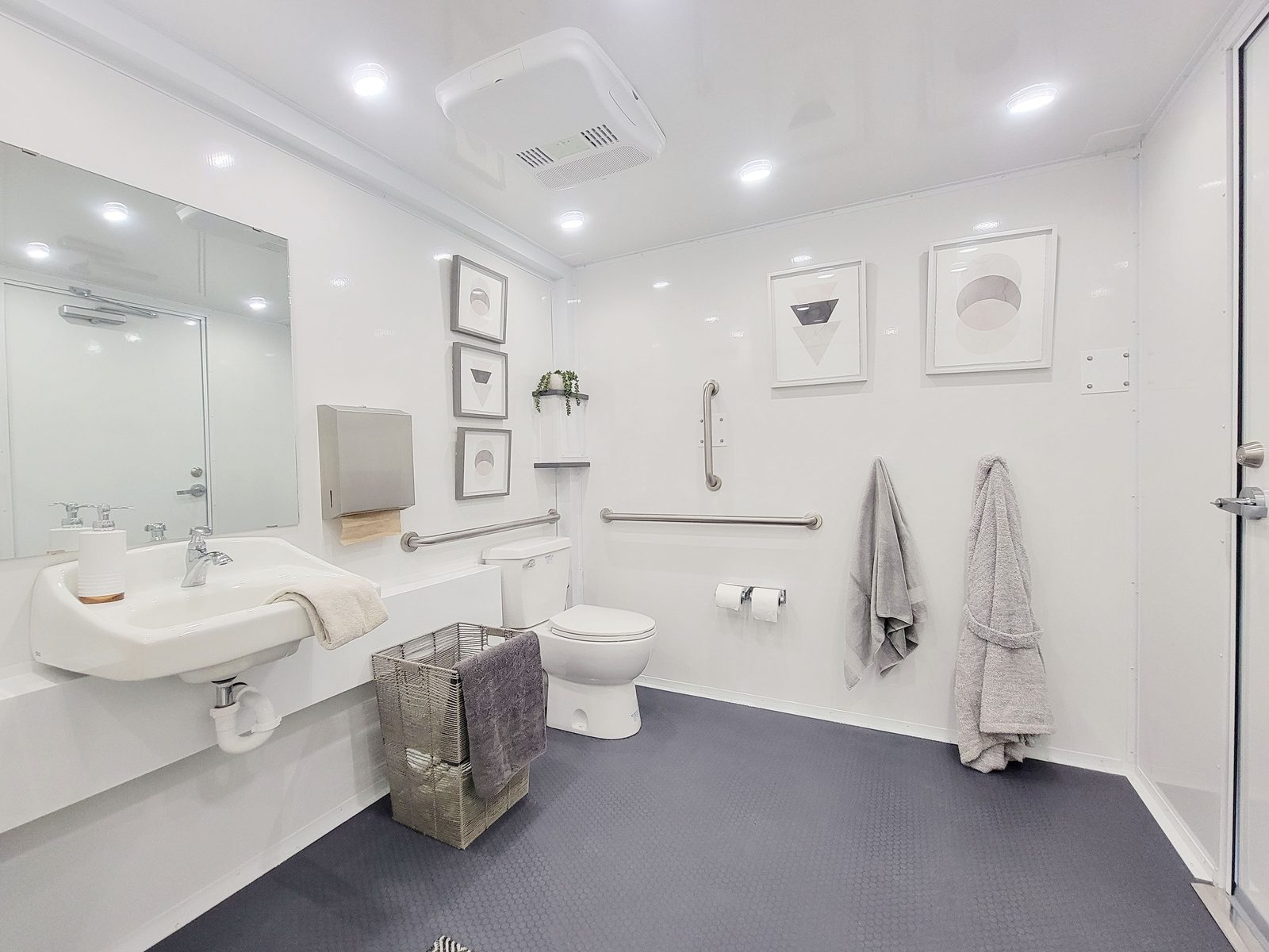 Accessible room in the single-station ADA shower and restroom combo with grab bars, wall sink and toilet, The Lavatory NorCal
