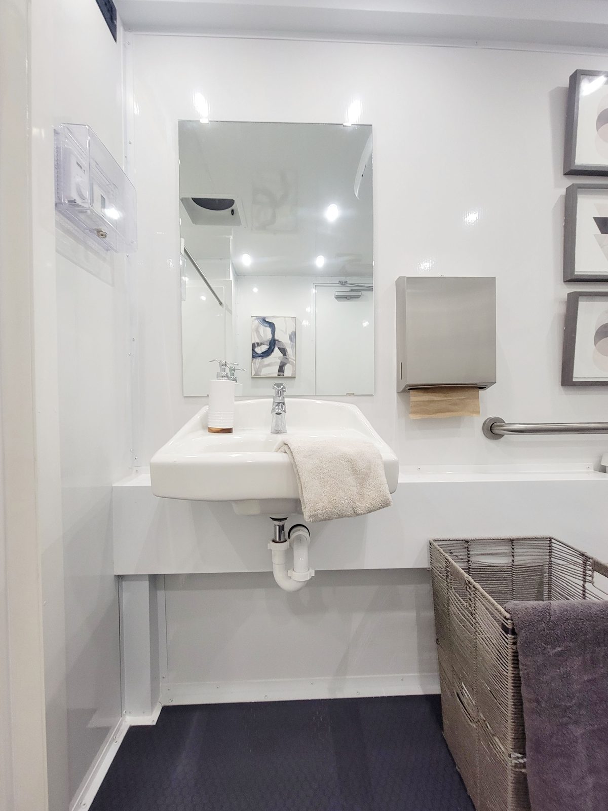 Roll-under wall sink with grab bar and mirror in the ADA shower and restroom combo, The Lavatory NorCal