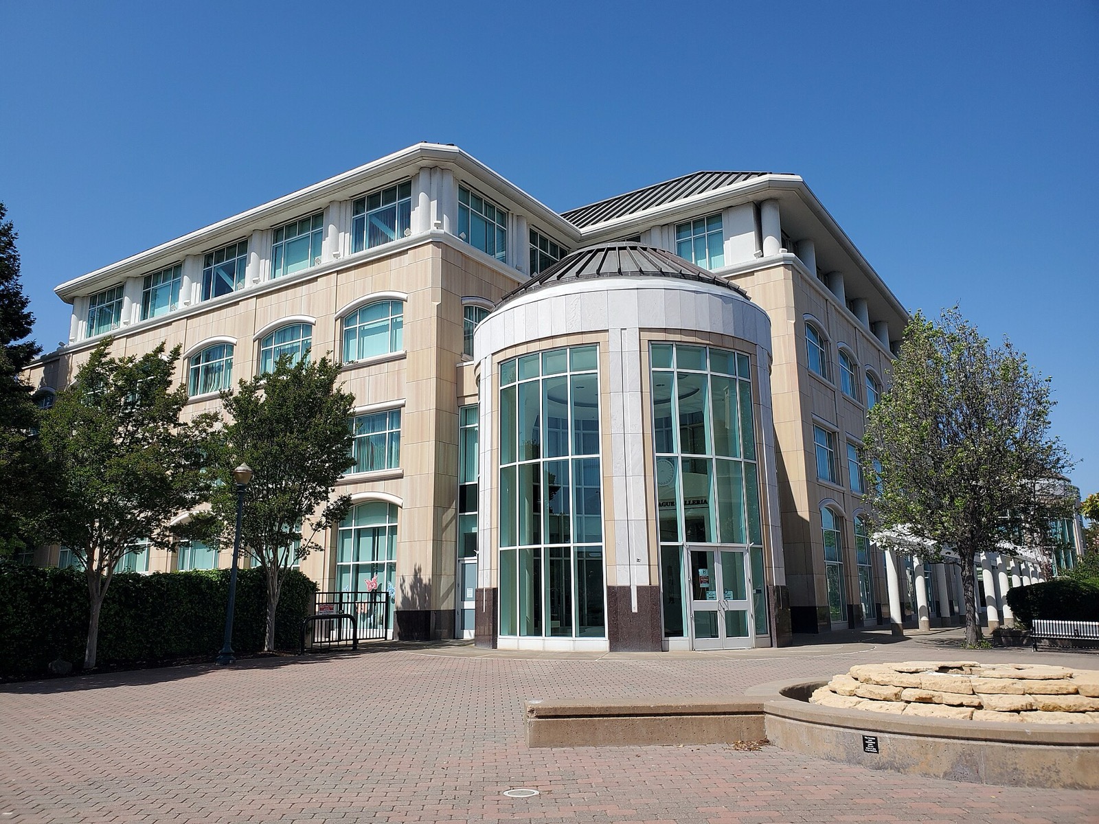 Hayward City Hall with its glass rotunda and brick plaza in downtown Hayward, an area served by The Lavatory NorCal