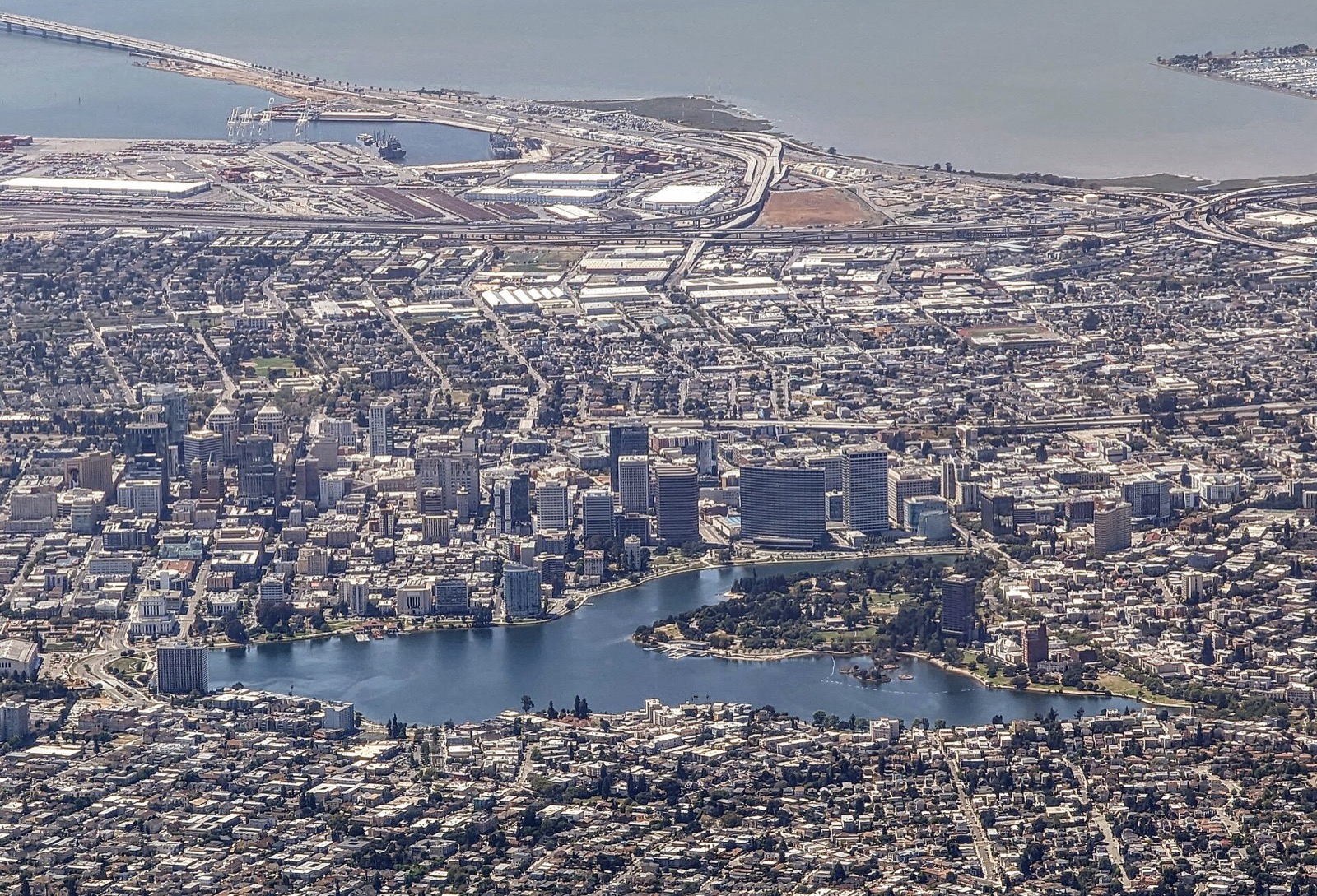 Aerial view of Lake Merritt and downtown Oakland with the port behind it, served by The Lavatory NorCal