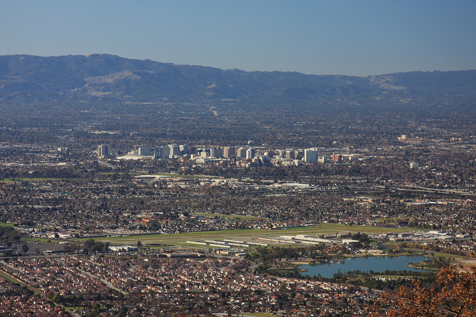 Downtown San Jose towers seen from the east foothills with Lake Cunningham in front, served by The Lavatory NorCal