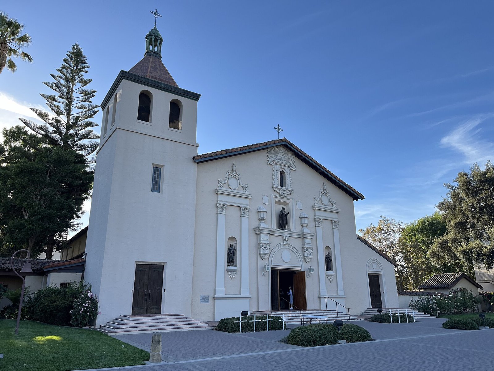 White bell tower and front of Mission Santa Clara de Asis on the university campus, served by The Lavatory NorCal