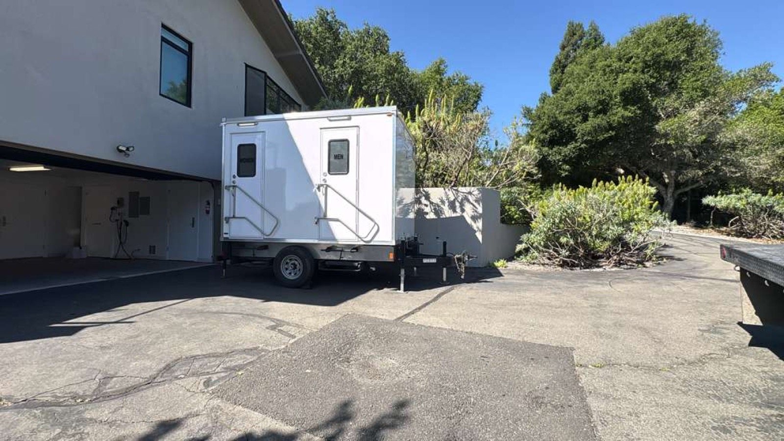 2-stall restroom trailer parked on a driveway beside a modern home in North Bay wine country, The Lavatory NorCal